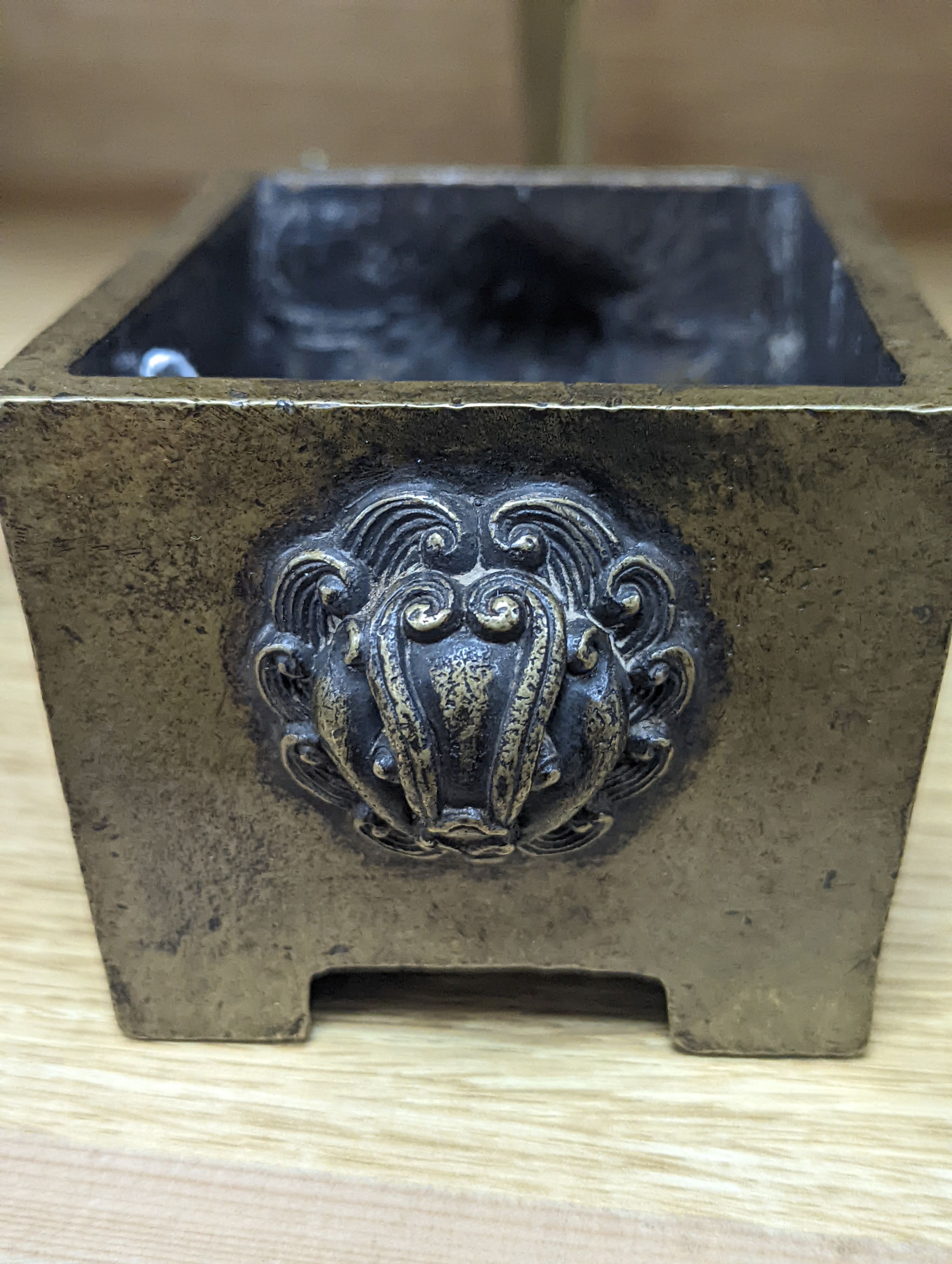 A Chinese bronze censer and a bronze boat
